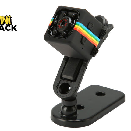 A black mini square action camera with a rainbow accent stripe mounted on an adjustable plastic stand, featuring the "Kiwi Shack" logo in the top-left corner.