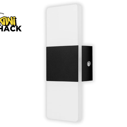 White and black wall light fixture with Kiwi Shack logo on a white background