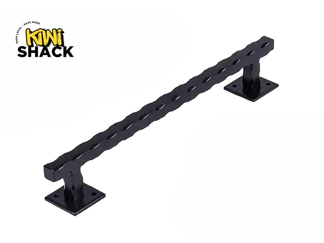 A black metal ladder rail with twisted slat detailing and square mounting brackets, shown on a white background with the Kiwi Shack logo in the top-left corner.