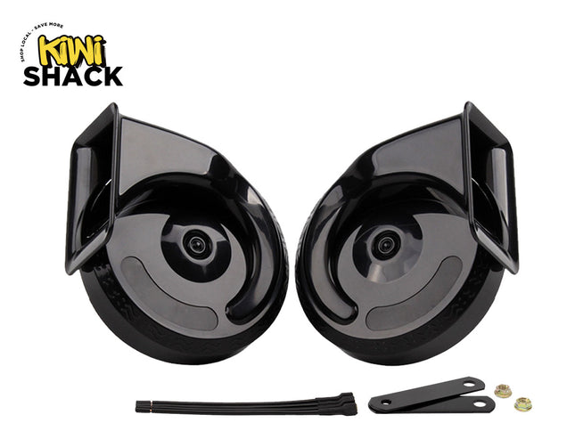 A pair of glossy black snail-type car horns displayed against a white background, accompanied by mounting brackets, zip ties, and fastening nuts, with the "Kiwi Shack" logo in the top left corner.