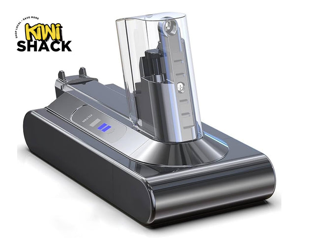 Silver and charcoal robotic vacuum cleaner auto-empty dock / charging base featuring a clear dust collection canister tower, status indicator lights labeled "FILTER", power dock contacts, and the Kiwi Shack logo watermark.