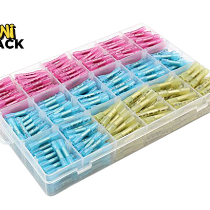 A clear plastic storage organizer tray filled with small individually wrapped fishing line or thread spools in pink, light blue, and pale yellow-green. The Kiwi Shack logo is visible in the top-left corner on a plain white background.