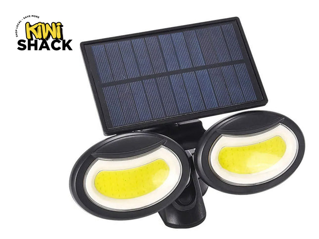 Solar-powered outdoor light fixture with two yellow lights and a solar panel on a white background, branded 'Kiwi Shack'.