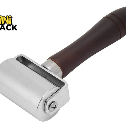 Heavy-duty steel wallpaper/laminate seam roller with a smooth cylindrical metal roller, side screw-fixed bracket, ergonomic turned dark wood handle with decorative groove rings, and the Kiwi Shack logo watermark.