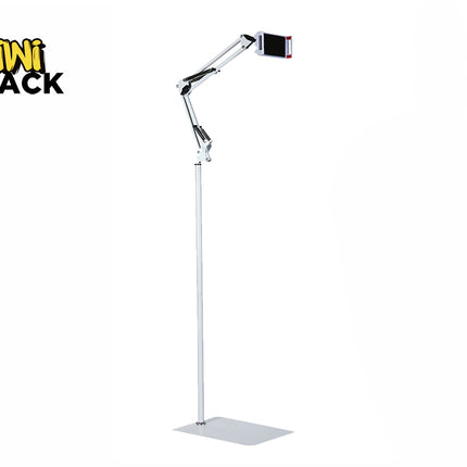 A tall white floor stand for a phone or tablet, featuring a flat rectangular base, a vertical extension pole, an articulated spring-loaded mechanical arm at the top, and a device clamp holding a phone, with the "Kiwi Shack" logo in the top left corner.