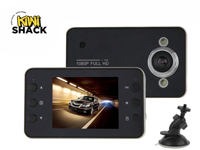 A 1080p full HD dashboard camera with a display screen showing a car in a tunnel, along with its rear view and suction mount, featuring the "Kiwi Shack" logo in the top-left corner.