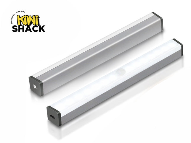 Two silver slim under-cabinet LED light bars with motion sensors and rechargeable USB ports, featuring a "Kiwi Shack" logo in the top left corner.