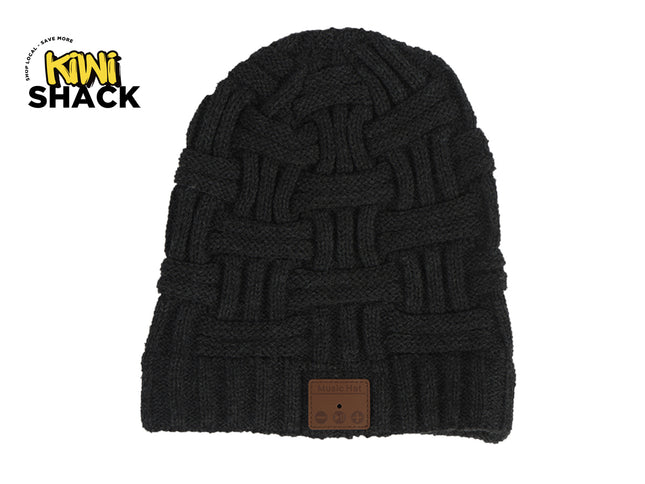 A black knitted winter beanie featuring a basketweave pattern and a brown leather control patch with integrated Bluetooth controls, featuring a "Kiwi Shack" logo in the top left corner.