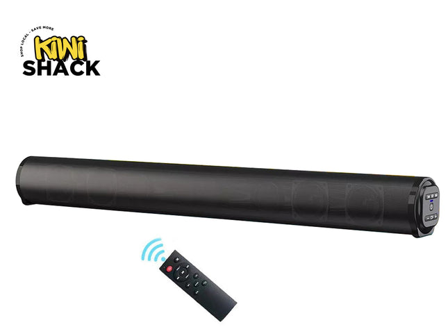 A black cylindrical mini soundbar with a remote control, shown on a white background with the KINI SHACK logo in the top left corner.