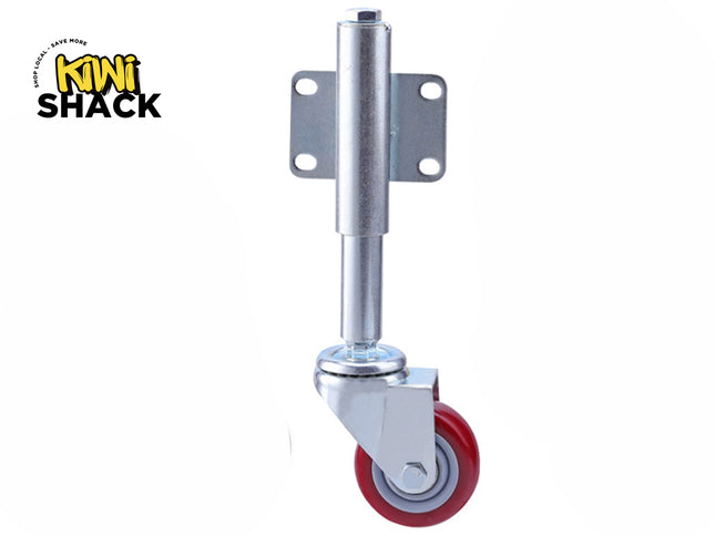 A heavy-duty metal swivel caster wheel with a red polyurethane wheel, a spring-loaded vertical mounting stem, and a flat plate with four pre-drilled bolt holes, set against a plain background with the "Kiwi Shack" logo in the top left corner.