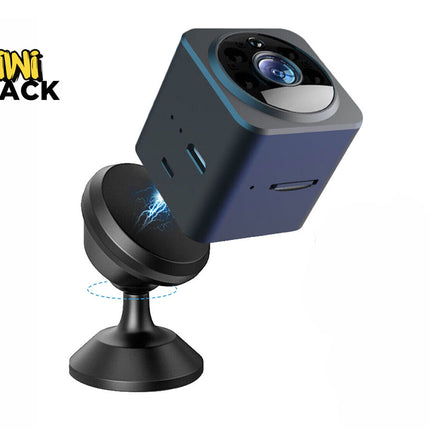 A compact dark blue mini cube security camera hovering above its magnetic rotating mount stand against a white background. A "Kiwi Shack" logo appears in the top-left corner.