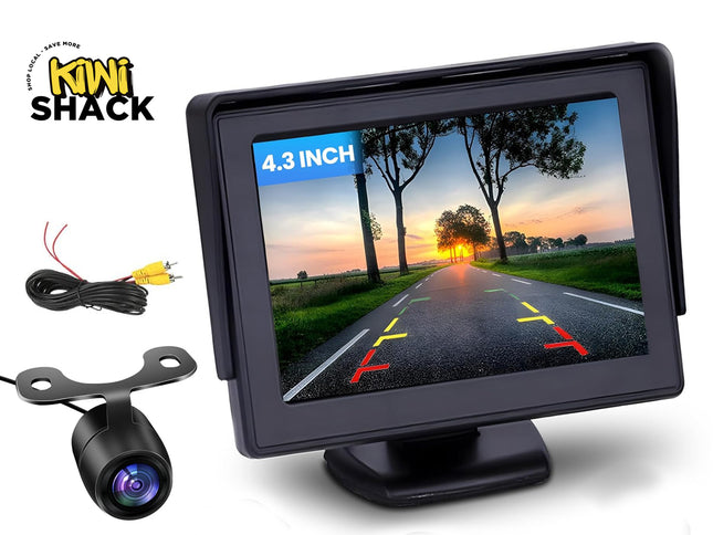 A 4.3-inch car backup monitor displaying a rearview camera feed with parking guidelines, alongside a rear camera and wiring cables, featuring the "Kiwi Shack" logo in the top-left corner.