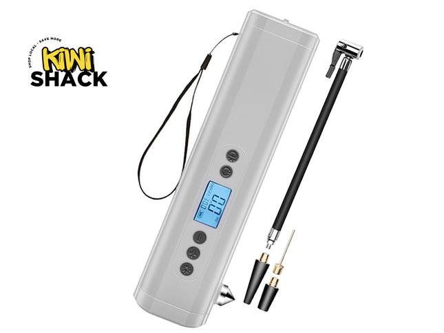 A digital tire inflator by Kiwi Shack, featuring a white plastic body with a clear protective cover, a small blue LCD screen, and four black buttons. It is shown with a black carrying strap, a black adjustable pump handle, and two nozzle tips on a plain white background.