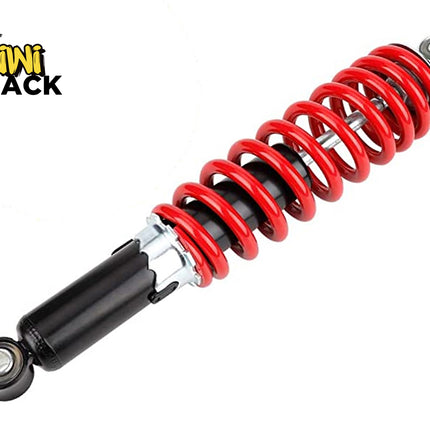 A heavy-duty motorcycle or ATV shock absorber with a bright red coil spring and black damping body, featuring the "Kiwi Shack" logo in the top-left corner.