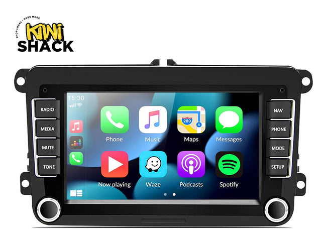 Car multimedia system with touchscreen display and control buttons, branded 'Kiwi Shack'.