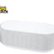 A modern white oval-shaped bedside smart speaker wrapped in textured gray acoustic fabric, featuring a wireless charging pad surface on top and a "Kiwi Shack" logo in the top left corner.