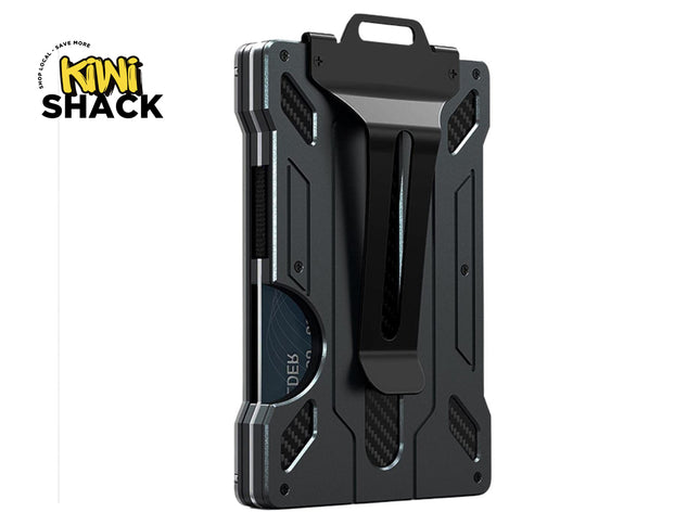 Black minimalist metal / carbon-fiber-accented slim RFID-blocking money clip wallet with a heavy-duty money clip on the back, card push-out/notch slot showing a card edge, exposed screws, and the Kiwi Shack logo watermark.