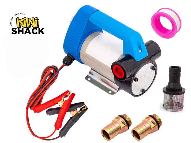 A portable 12V electric transfer pump kit with a blue handle, wired battery alligator clips, hose fittings, a filter screen, and sealing tape, featuring a "Kiwi Shack" logo in the top left corner.