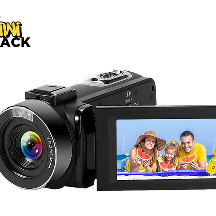 Black digital camera with a screen displaying a family at the beach, branded 'Kiwi Shack'.
