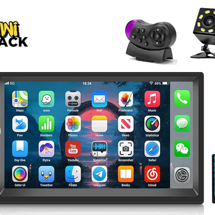 A double-DIN car stereo head unit with a touchscreen interface, a backup camera, a steering wheel remote control, and a handheld remote, featuring the "Kiwi Shack" logo in the top-left corner.