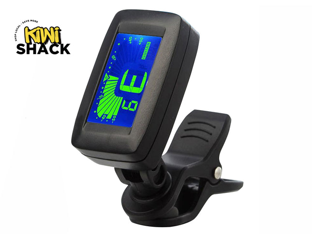 A black digital clip-on tuner with a blue and green LCD screen displaying an E major chord, shown on a white background with the Kiwi Shack logo in the top-left corner.