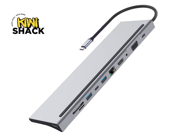 A silver aluminum USB-C hub with a black cable, shown at an angle on a white background with a Kiwi Shack logo in the top-left corner.