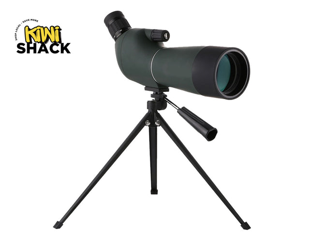 Dark-green and black spotting scope with angled eyepiece, focus ring, sunshade hood/objective lens ring, mounted on a small black folding desktop/tabletop tripod with pan-tilt adjustment handle, and featuring the Kiwi Shack logo watermark.