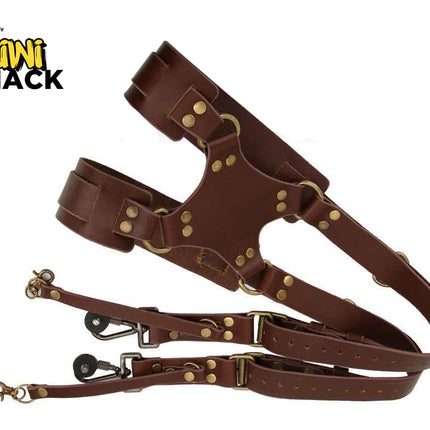 Brown leather harness with gold hardware on a white background, featuring the Kiwi Shack logo.