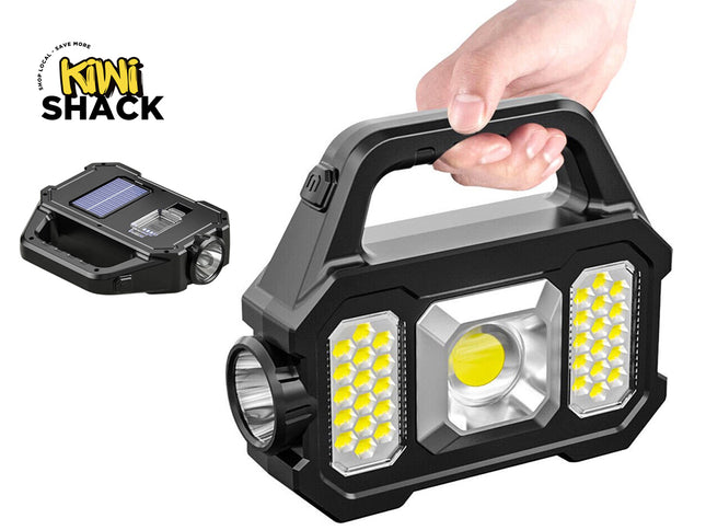 Handheld flashlight with multiple lights and a hand holding it, branded as Kiwi Shack.