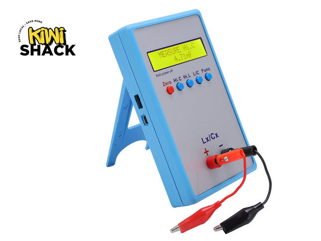 Digital multimeter with red and black leads on a white background, branded 'Kiwi Shack'.