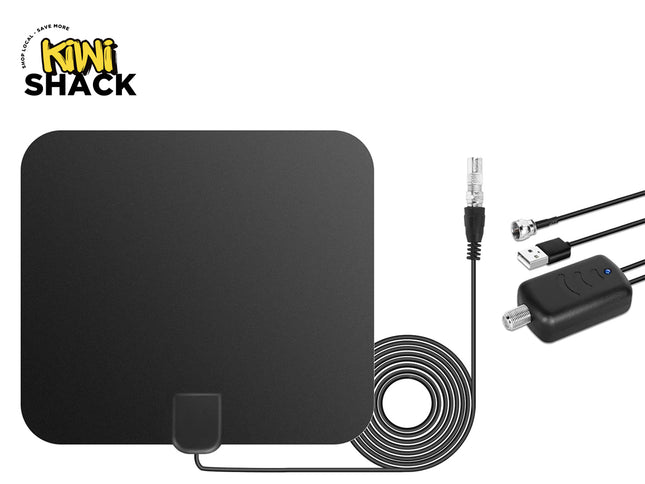 A flat, black indoor HDTV antenna with a coiled coaxial cable, a signal amplifier box, and USB power and connector cables against a white background, featuring the "Kiwi Shack" logo in the upper left corner.