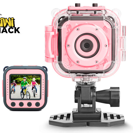 Pink and black kids' action camera with a clear protective housing and mounting bracket, shown alongside a small screen view of the camera display. The Kiwi Shack logo is visible in the top left corner.