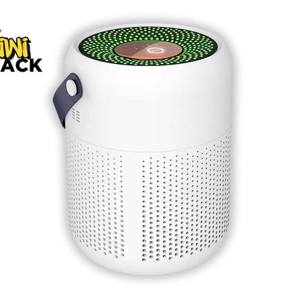 A white cylindrical portable speaker with a green LED ring on top and a dark blue carrying handle, shown on a white background with a Kiwi Shack logo in the top-left corner.