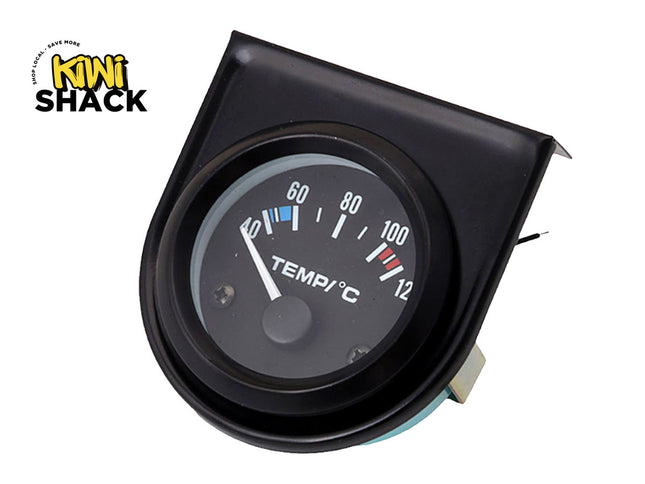 Black automotive temperature gauge with analog needle pointing below 60°C, mounted in a black angled pod housing, featuring Kiwi Shack logo in top left.