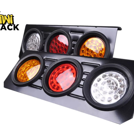 A black vehicle light bar with six circular lights, including three red and amber lenses and three white/silver lenses, shown on a white background with a Kiwi Shack logo in the top-left corner.