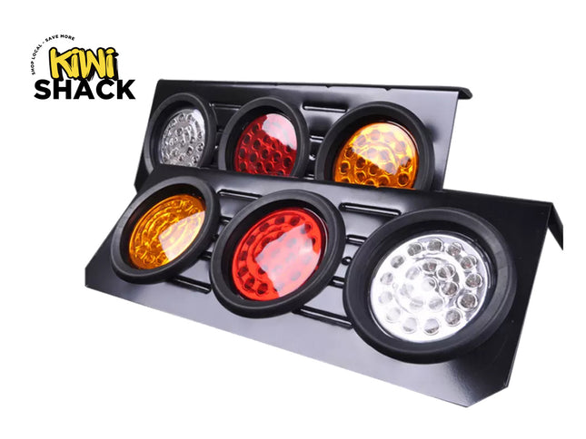A black vehicle light bar with six circular lights, including three red and amber lenses and three white/silver lenses, shown on a white background with a Kiwi Shack logo in the top-left corner.