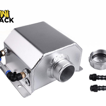 A silver aluminum oil catch can featuring visible welded seams, a side-mounted sight tube with black and blue push-connect fittings, a threaded central inlet port, a threaded cap, and two barbed hose fittings, set against a white background. A "Kiwi Shack" logo appears in the top-left corner.