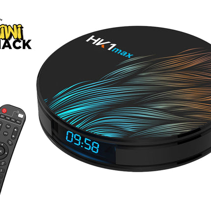 A black Kiwi Shack HX1max streaming box with a colorful blue, teal, and orange wave pattern on top, shown next to its remote control on a white background.