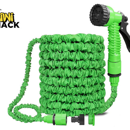A green expandable garden hose coiled neatly with a matching spray nozzle and connectors, featuring the "Kiwi Shack" logo in the top-left corner.