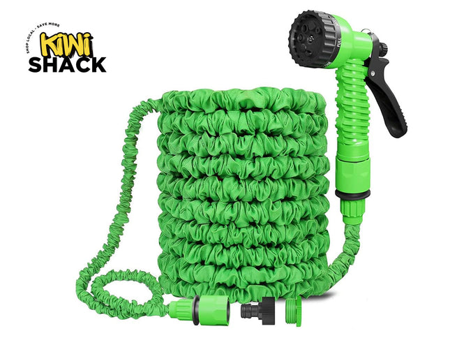 A green expandable garden hose coiled neatly with a matching spray nozzle and connectors, featuring the "Kiwi Shack" logo in the top-left corner.
