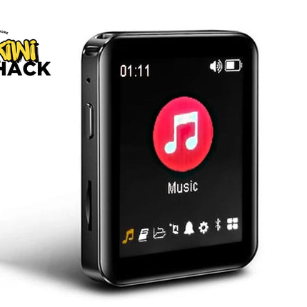 A black rectangular portable music player with rounded corners, shown at a three-quarter angle on a white background. The screen displays a music player interface with a red circle containing a white music note and the word 'Music'.