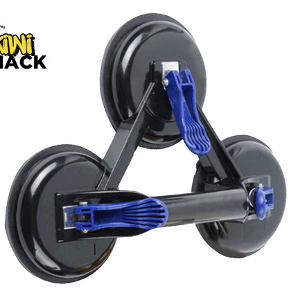A heavy-duty triple suction cup dent puller and glass lifter with black pads, a rigid triangular frame, and blue quick-release locking levers against a white background, featuring the "Kiwi Shack" logo in the upper left corner.