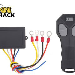 A wireless winch remote control kit with a receiver box, colored wiring harness, ring terminals, and a handheld transmitter, featuring the "Kiwi Shack" logo in the top-left corner.