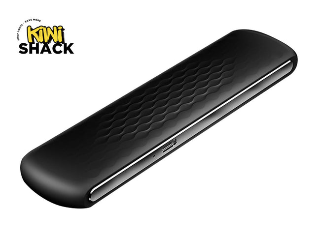 A sleek, matte black wireless presentation clicker or presenter remote with a textured wave pattern and a silver side-mounted charging port, set against a white background. A "Kiwi Shack" logo appears in the top-left corner.