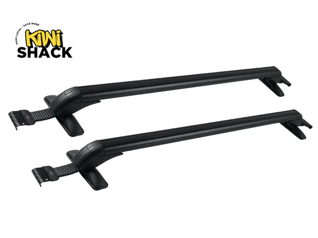 Two black roof rack crossbars shown on a plain white background, with the Kiwi Shack logo in the top-left corner.