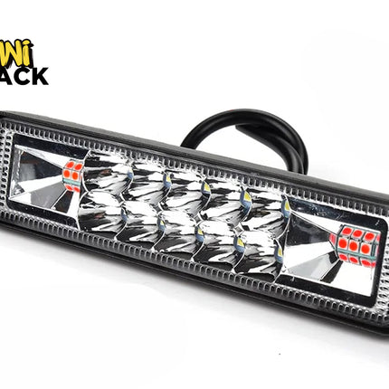 A rectangular LED light bar featuring multifaceted reflector optics, clear lens, and black housing with rear wiring, featuring a "Kiwi Shack" logo in the top left corner.