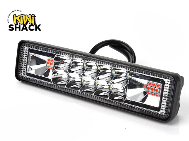 A rectangular LED light bar featuring multifaceted reflector optics, clear lens, and black housing with rear wiring, featuring a "Kiwi Shack" logo in the top left corner.