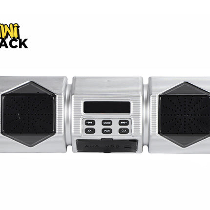 A silver motorcycle or bicycle handlebar audio system featuring two hexagonal speaker grilles flanking a central control unit with a digital display, playback buttons, and AUX/USB ports against a white background, featuring the "Kiwi Shack" logo in the upper left corner.