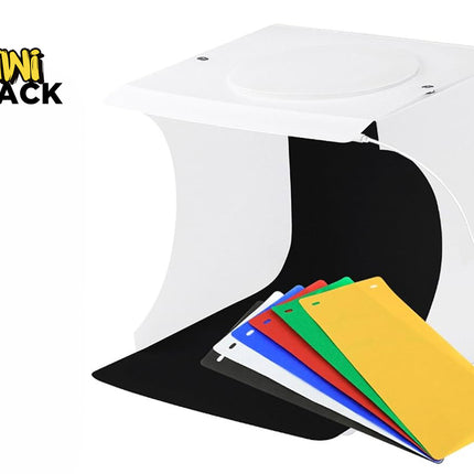 Kiwi Shack portable LED photo studio light box kit for product photography with multi-color backdrop inserts and built-in lighting.
