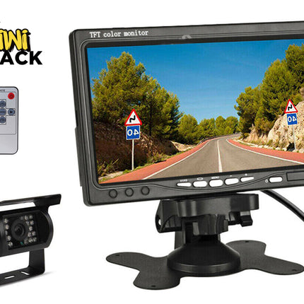 Car monitor with remote control and camera, branded as Kiwi Shack, displaying a road scene.